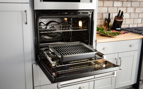 An open wall oven in a modern kitchen