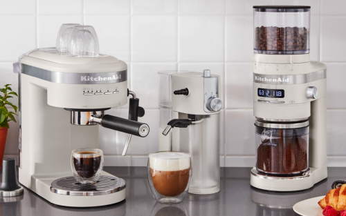 Three KitchenAid® coffee machines on a counter.