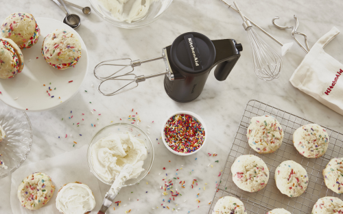 Hand mixer next to cookies on counter