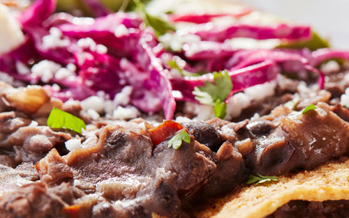 Black Bean Tostadas with Queso Fresco and Tangy Avocado Slaw