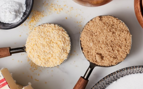 An assortment of ground sugars, breadcrumbs and powders