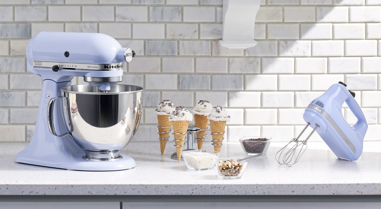 hand-vs-stand-differences Stand mixer and hand mixer on counter with ice cream cones