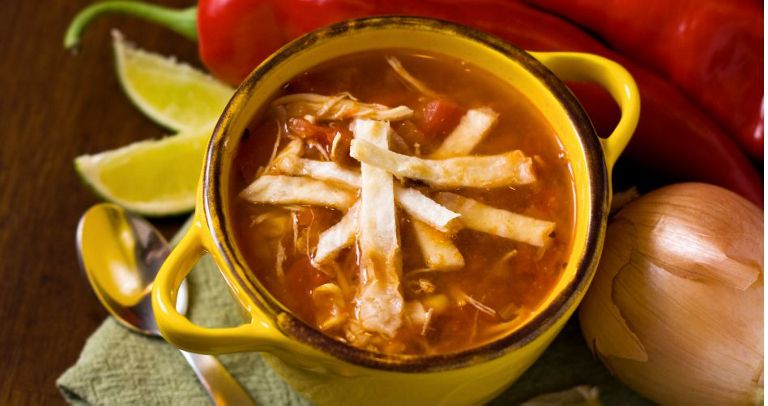 A bowl of chicken lime tortilla soup