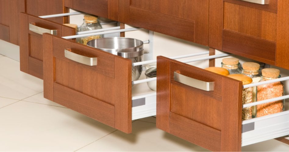 Pullout cabinet drawers with various kitchen items