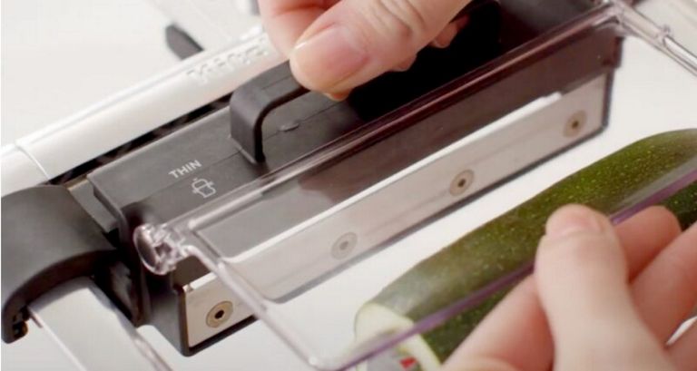 A blade is inserted into the blade carrier of a KitchenAid Stand Mixer